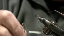 Video thumb for Jim Auman Tying one of his Midges